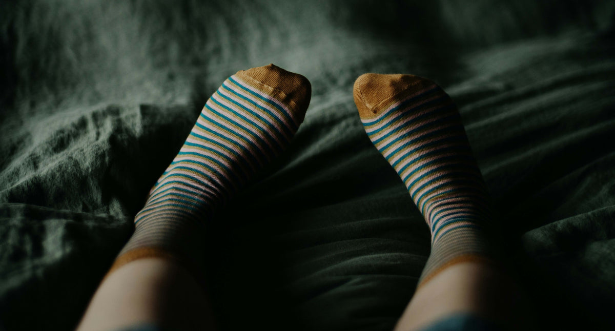 Ladies feet wearing stripey socks