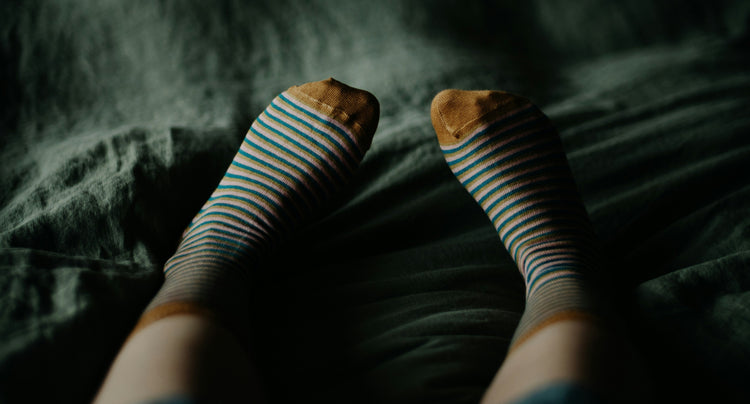 Ladies feet wearing stripey socks