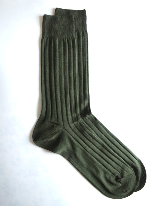 Pair of green socks on a white background
