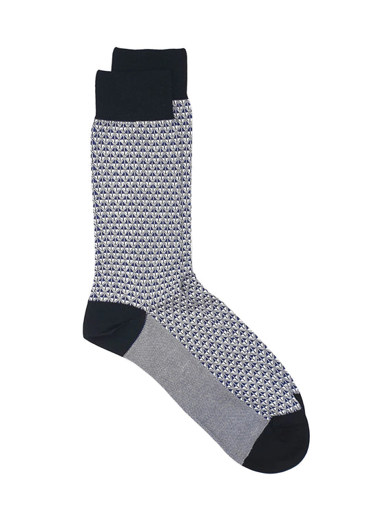 Blue and black patterned sock on a white background